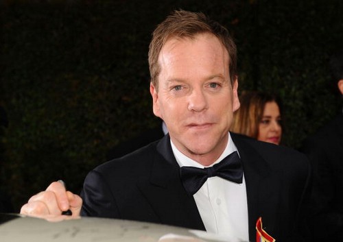 Celebrities Sign Charity Car At 67th Annual Golden Globe Awards