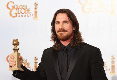 Christian Bale poses with his Golden Glo