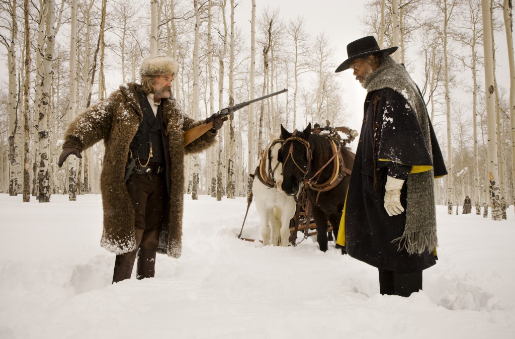 (L-R) KURT RUSSELL and SAMUEL L. JACKSON star in THE HATEFUL EIGHT. Photo: Andrew Cooper, SMPSP © 2015 The Weinstein Company. All Rights Reserved.